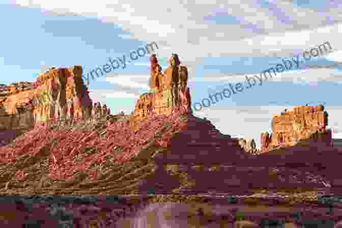 A Stunning Photograph Of The Bears Ears National Monument, Capturing The Rugged Beauty Of Its Sandstone Cliffs And Hoodoos. Behind The Bears Ears: Exploring The Cultural And Natural Histories Of A Sacred Landscape